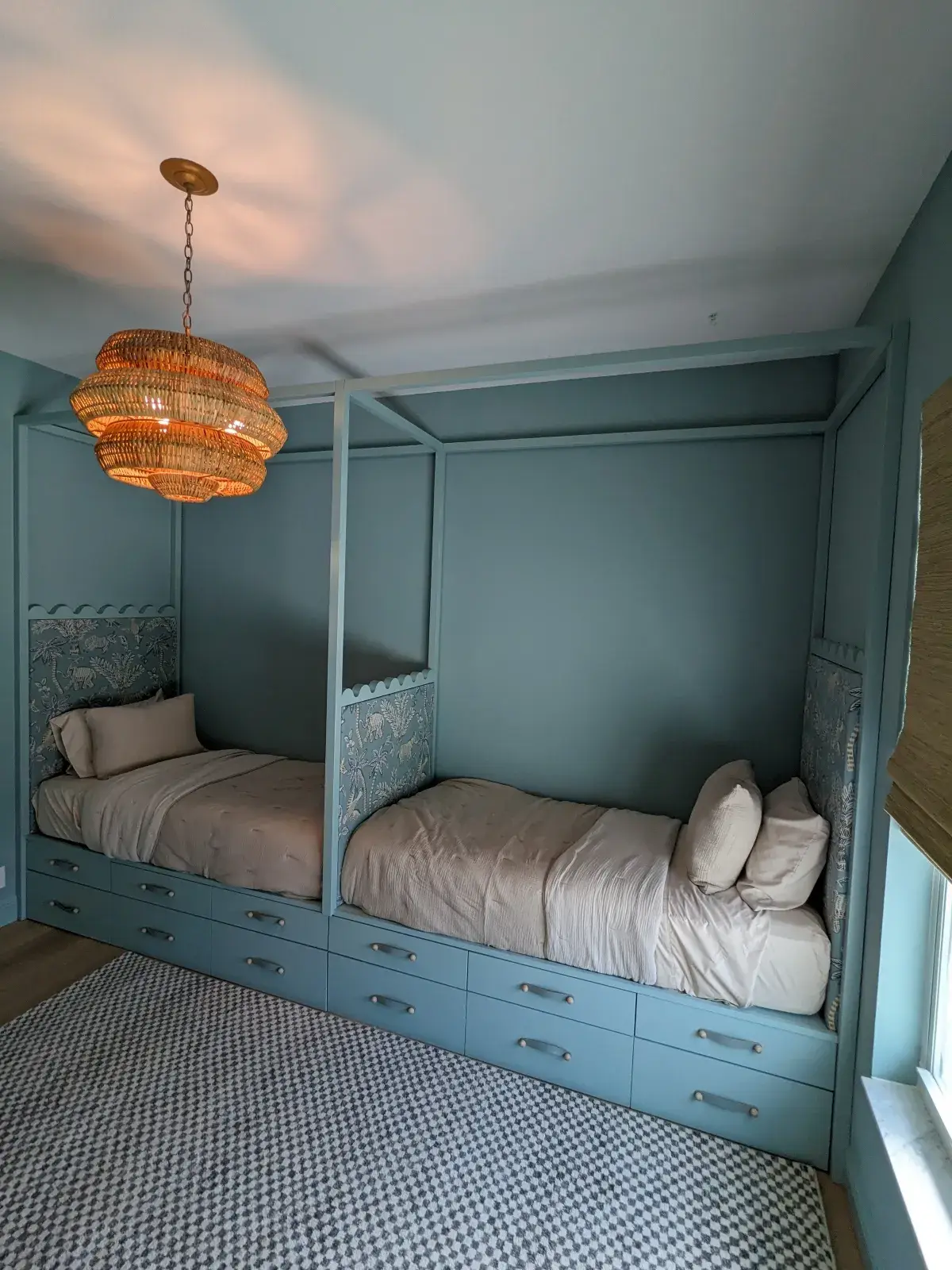 Two green twin beds in a childrens room