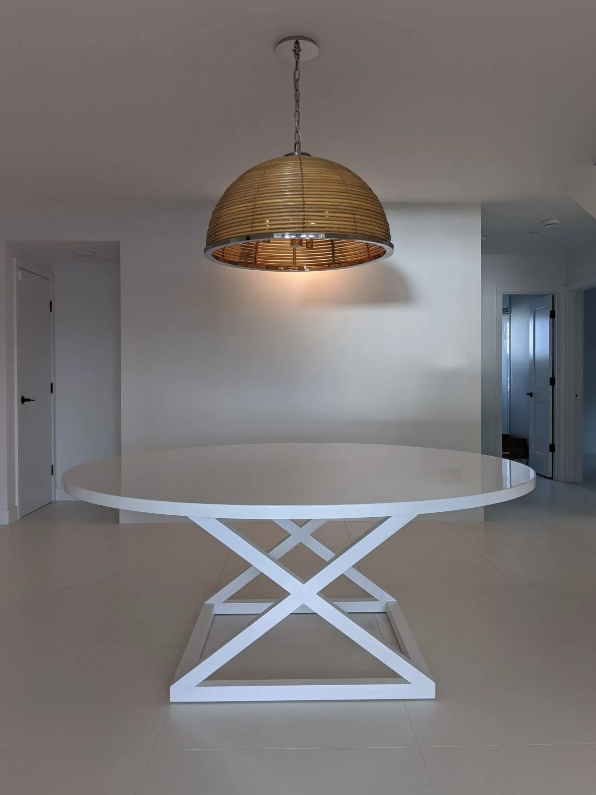 High gloss white table with X leg base